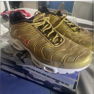 - Gold nike 97s